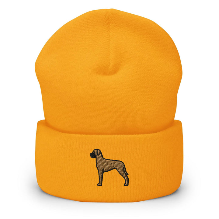 a yellow beanie with a black dog on it