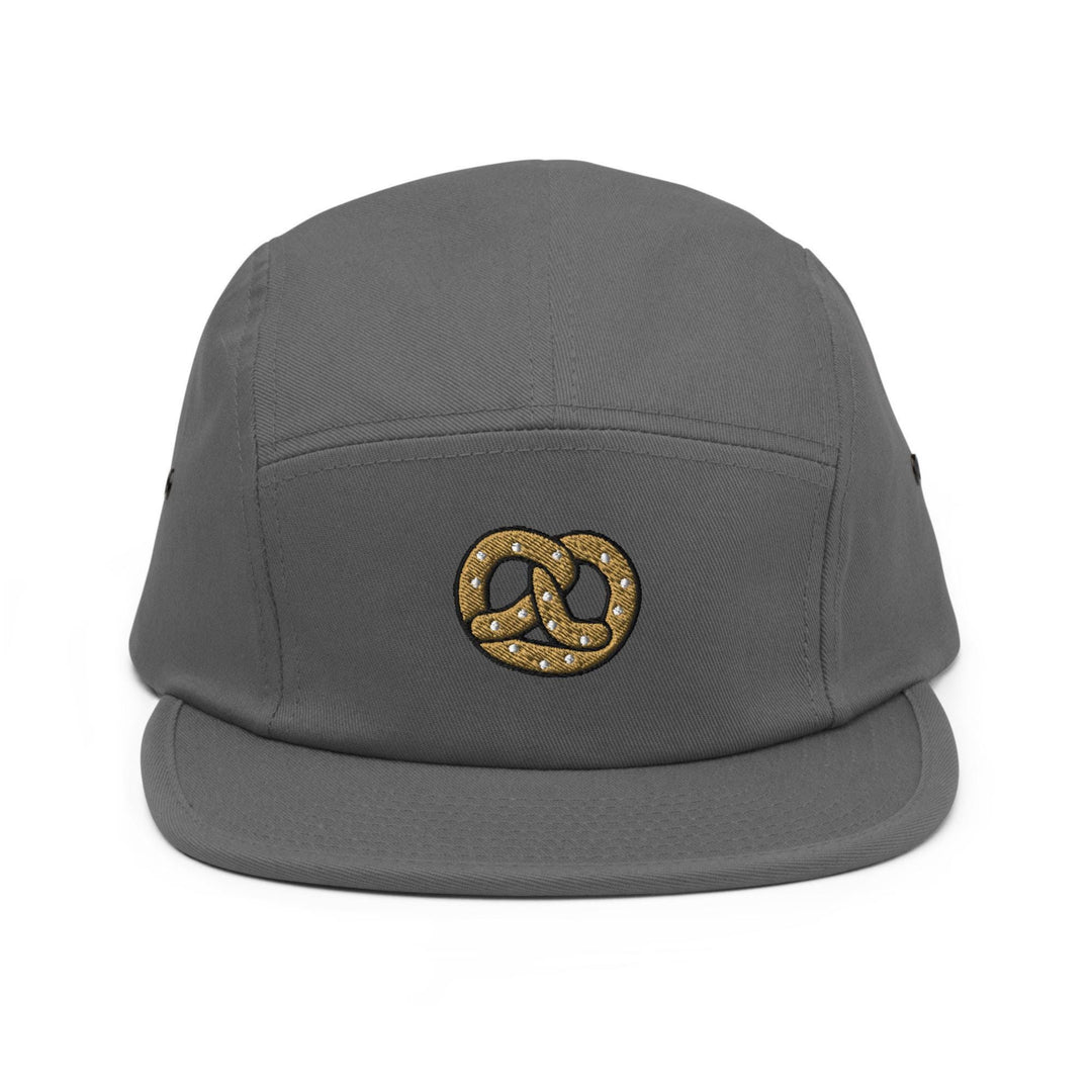 a grey hat with a gold logo on it