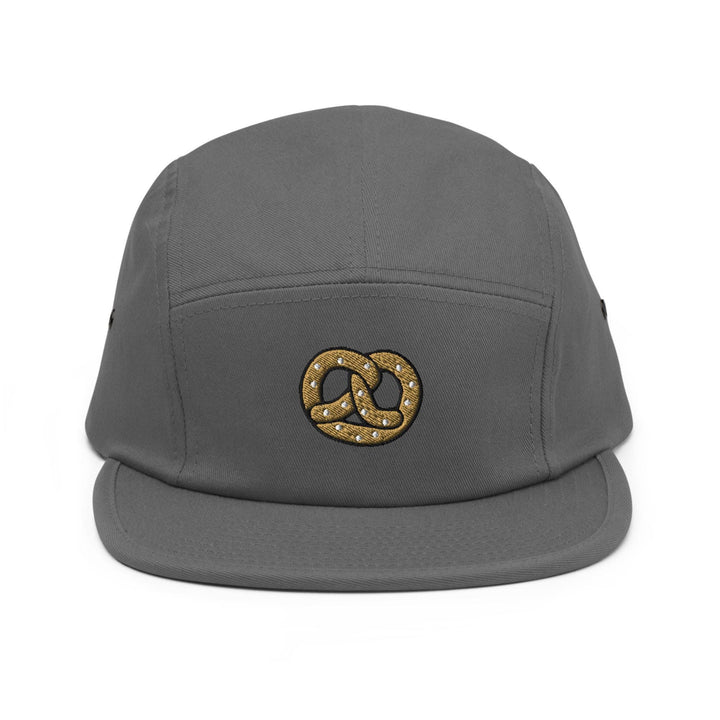 a grey hat with a gold logo on it