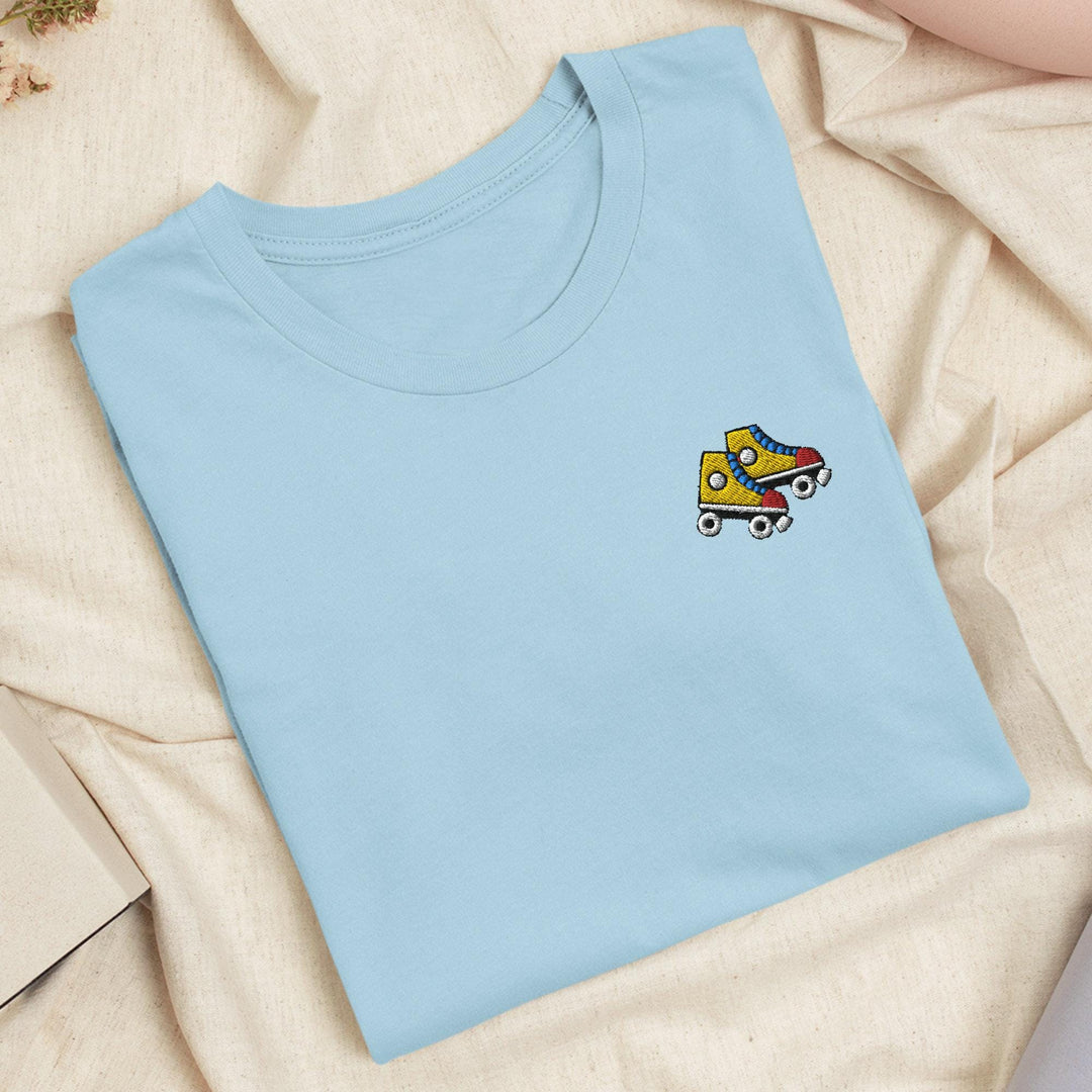 a blue t - shirt with a yellow truck embroidered on it