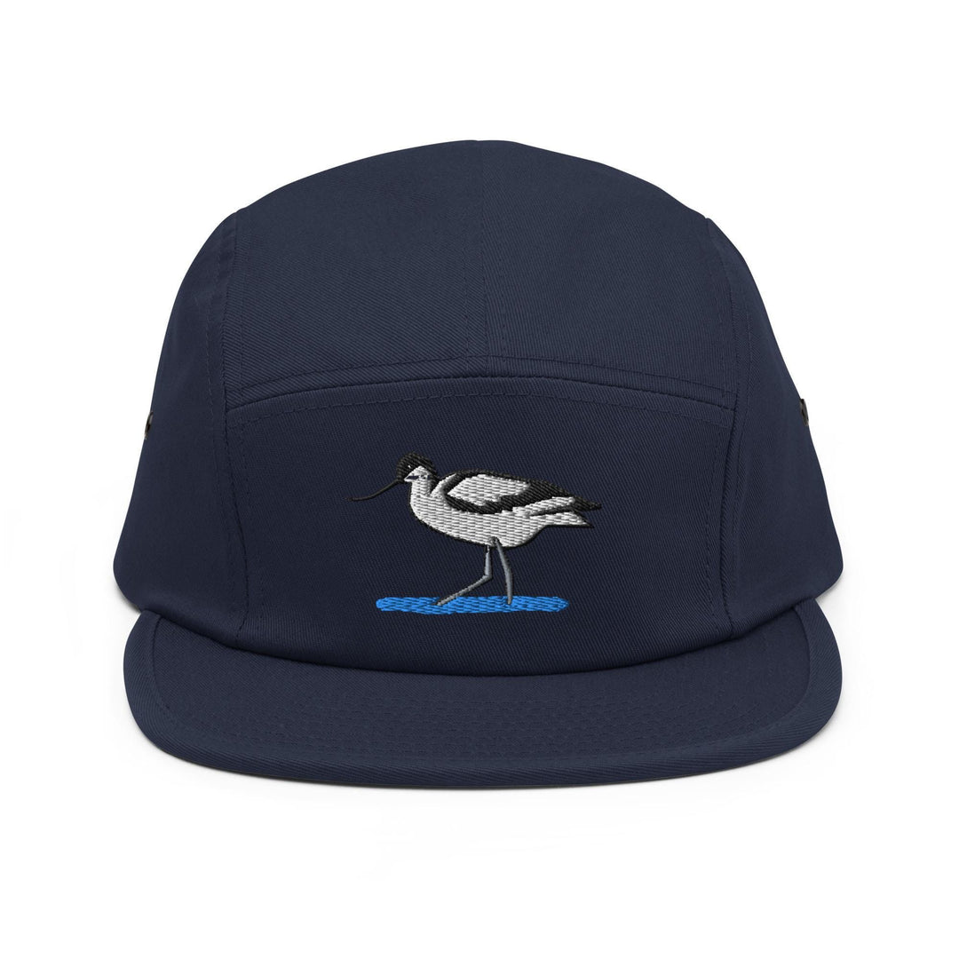 a blue hat with a bird embroidered on it
