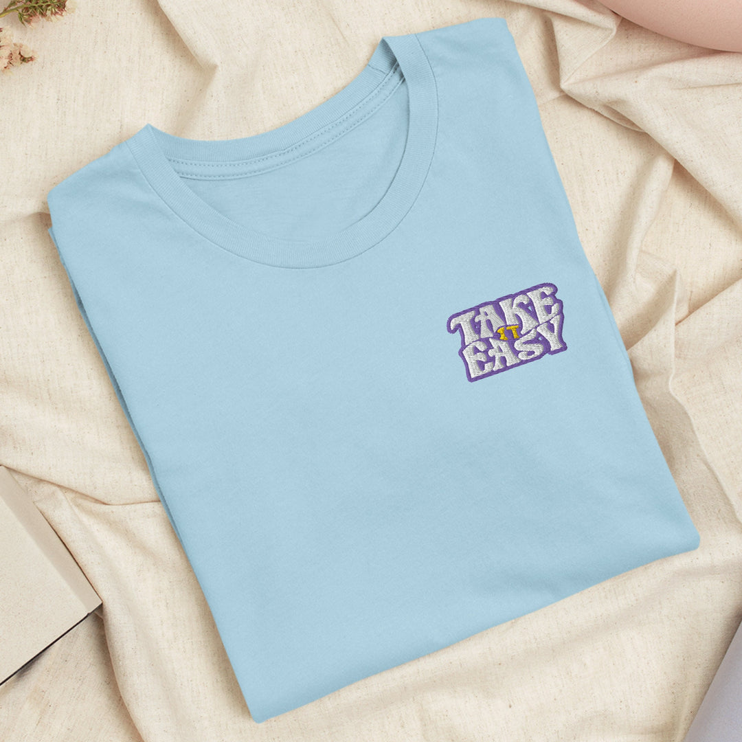 a blue t - shirt with the words take easy on it