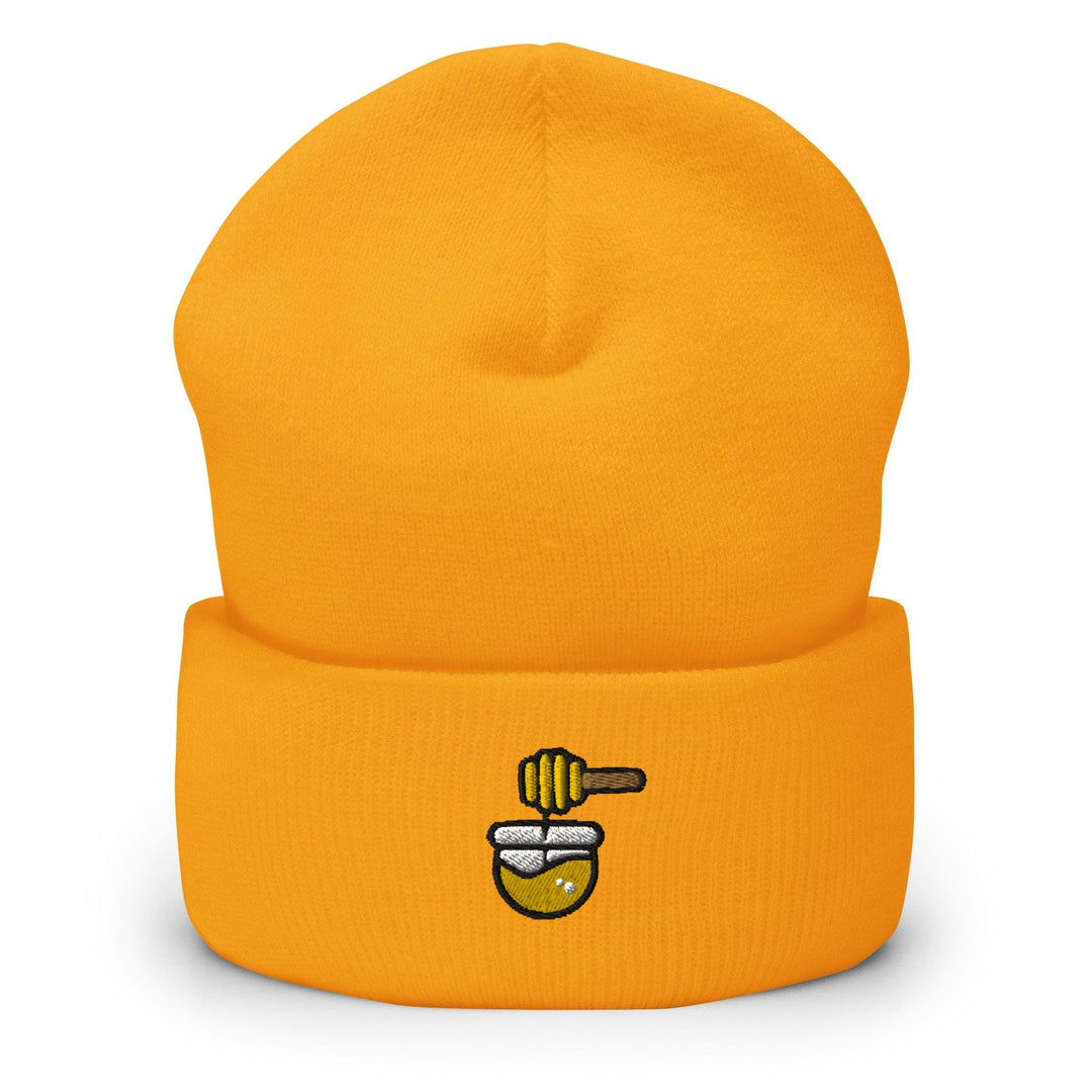 a yellow hat with a bee on it