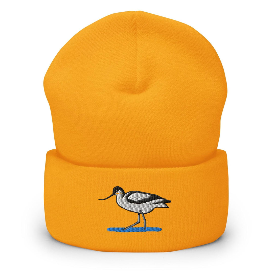 a yellow hat with a bird embroidered on it
