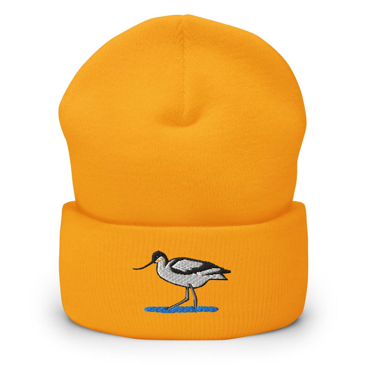 a yellow hat with a bird embroidered on it