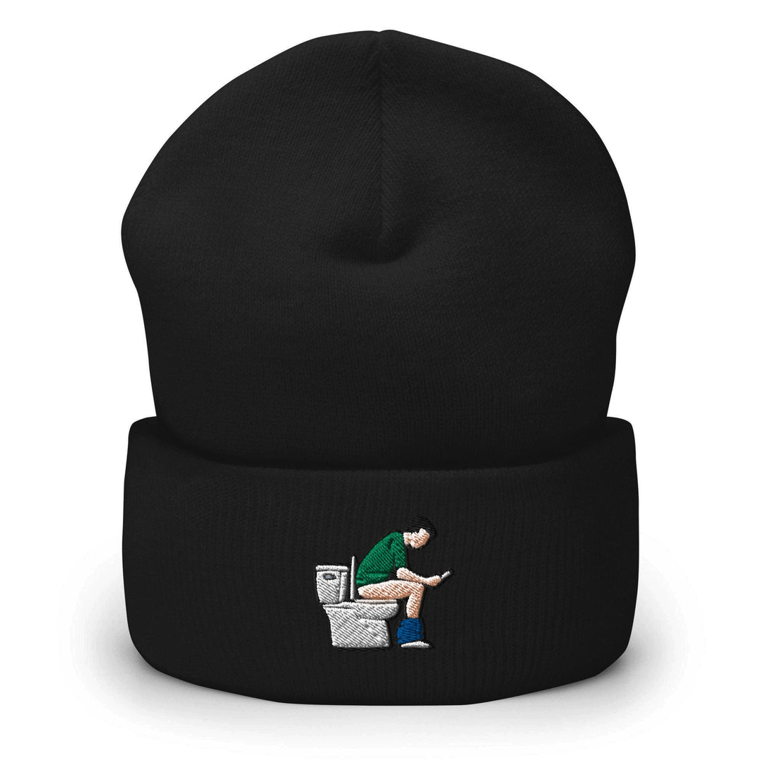 a black beanie with a picture of a man sitting on a toilet