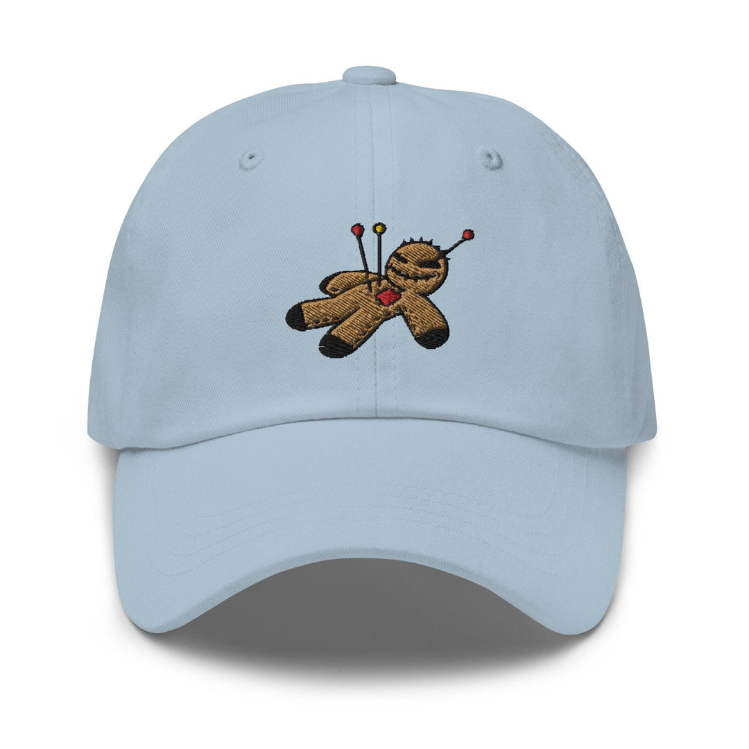 a light blue hat with a teddy bear holding a golf club