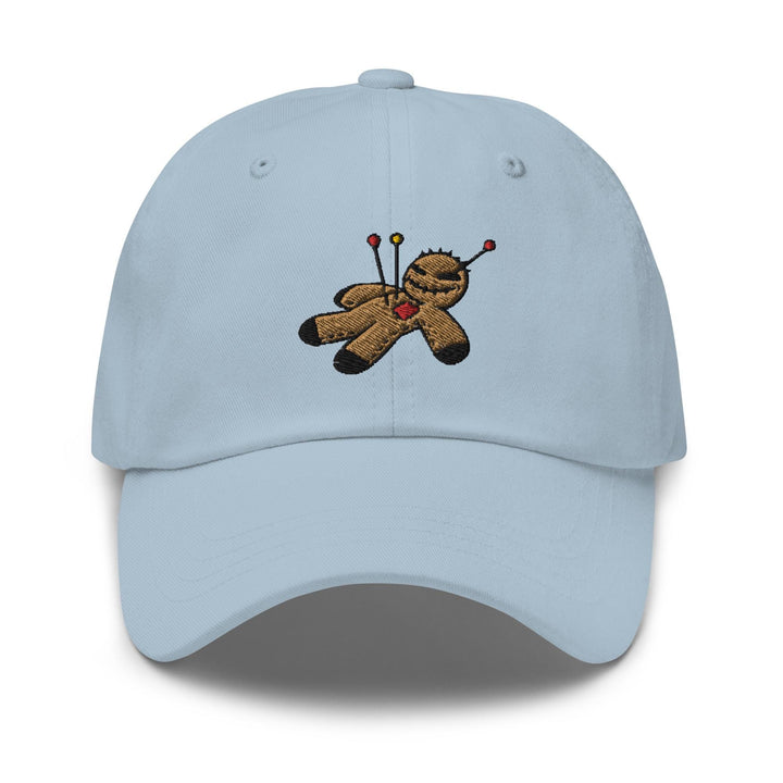a light blue hat with a teddy bear holding a golf club