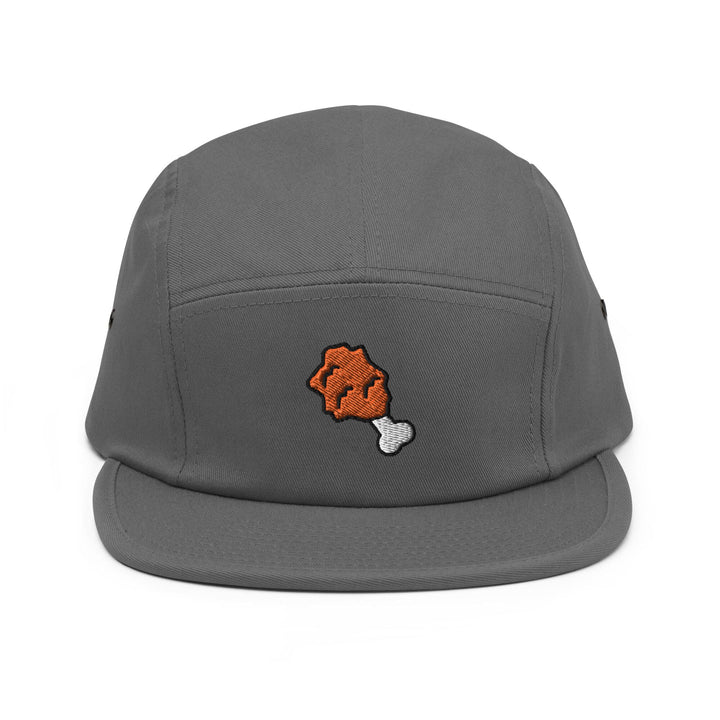 a gray hat with an orange bear embroidered on it