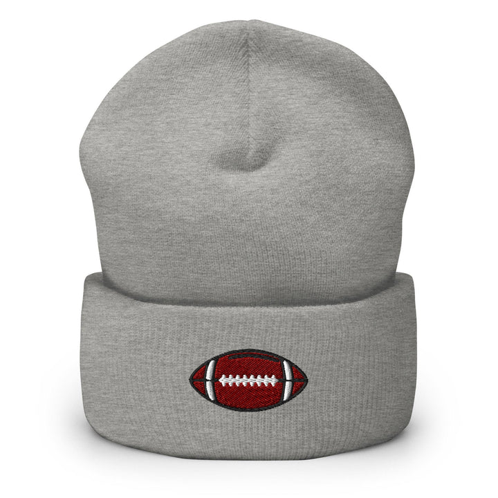 a gray beanie with a football embroidered on it