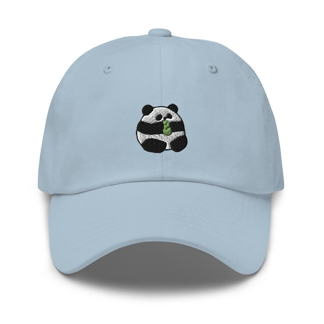a light blue hat with a panda eating a leaf