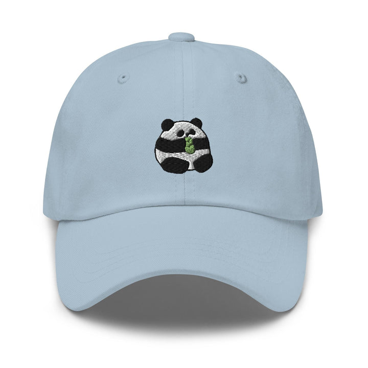 a light blue hat with a panda eating a leaf