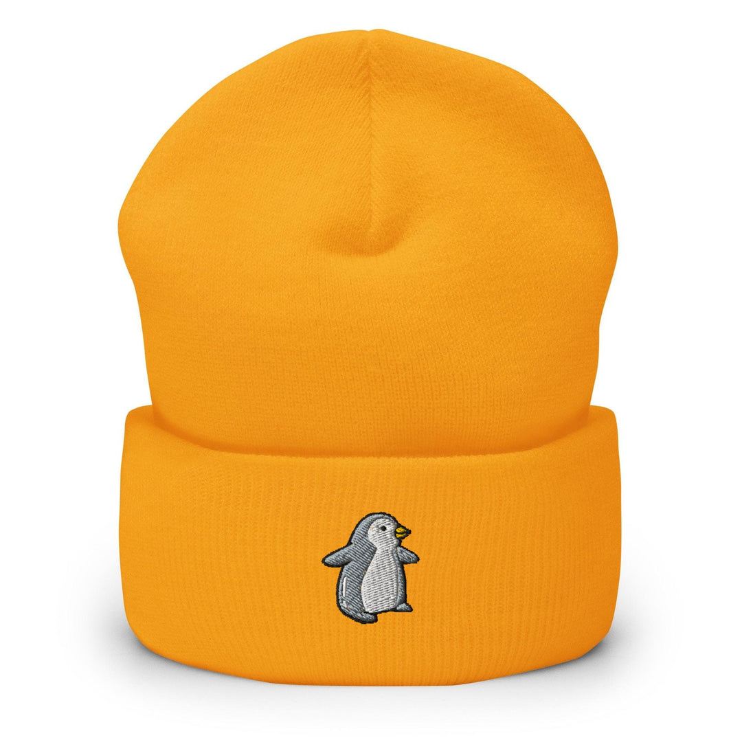 a yellow hat with a penguin embroidered on it