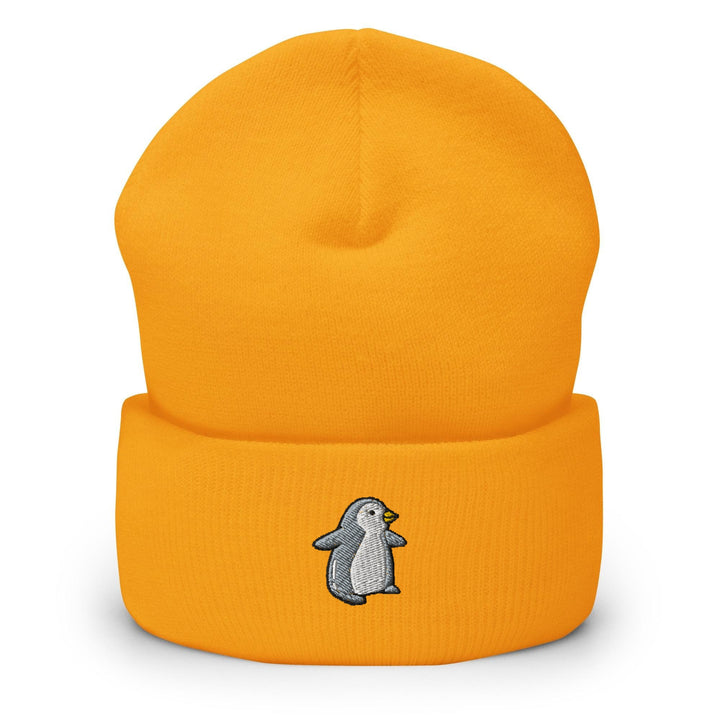 a yellow hat with a penguin embroidered on it