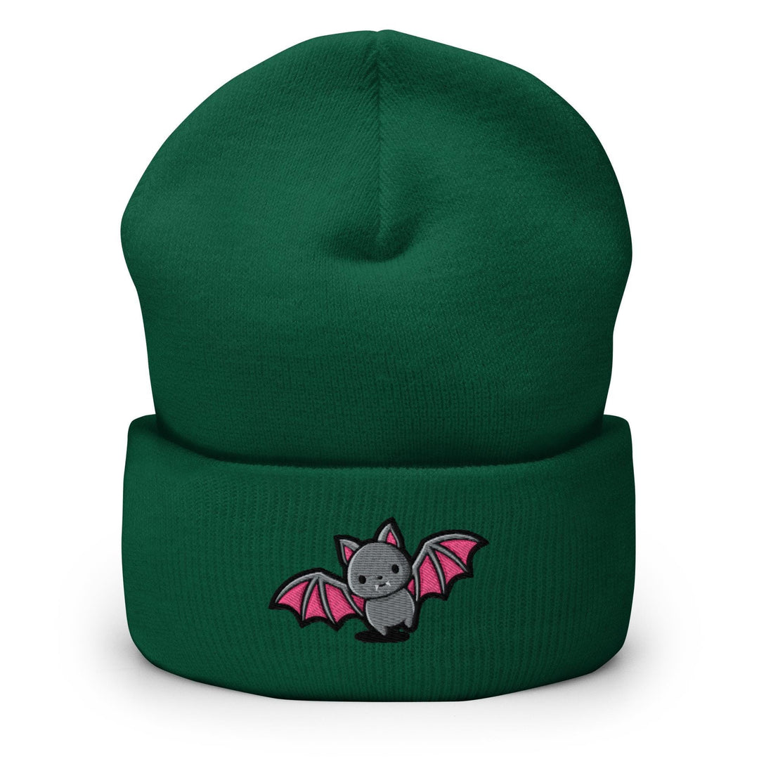 a green beanie with a bat embroidered on it