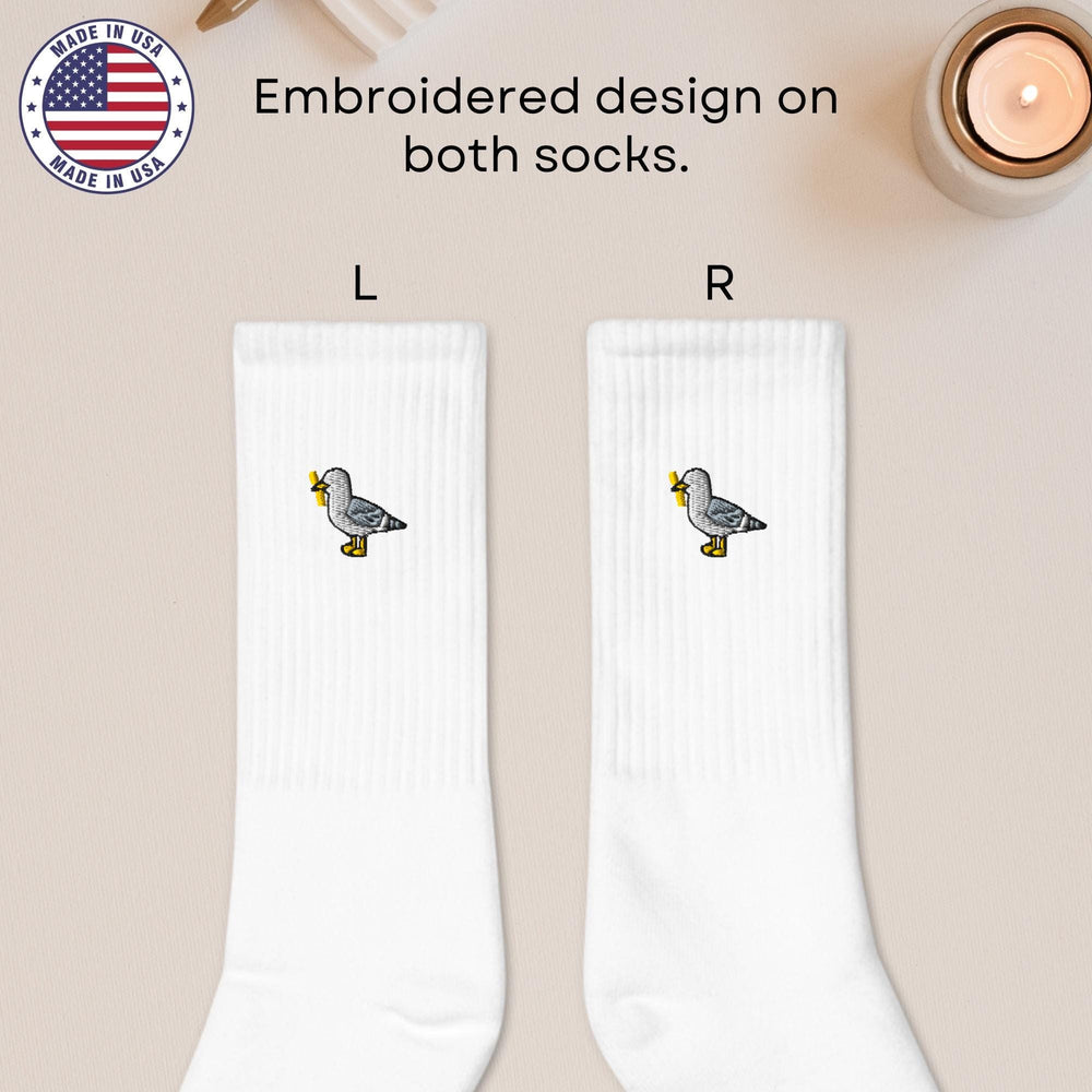 a pair of white socks with ducks on them