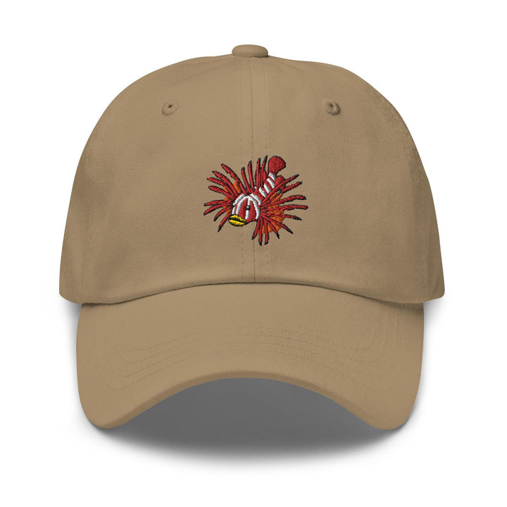 a tan baseball cap with a red and yellow crab on it