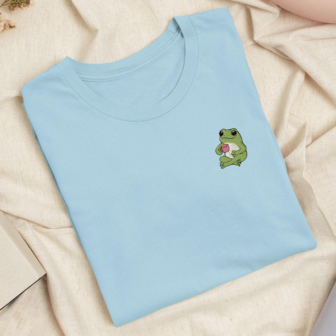 a t - shirt with a frog holding a heart