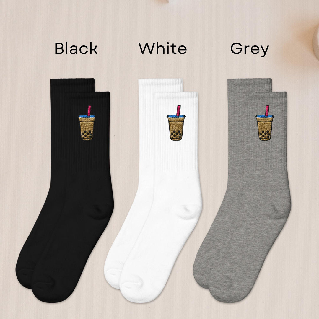 three pairs of socks with drinks on them