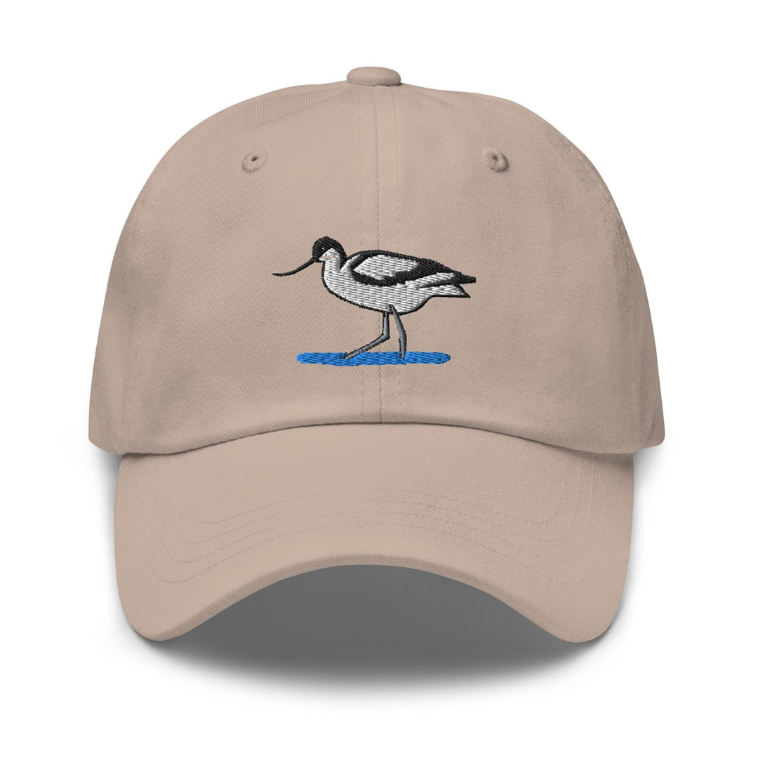 a tan hat with a bird embroidered on it