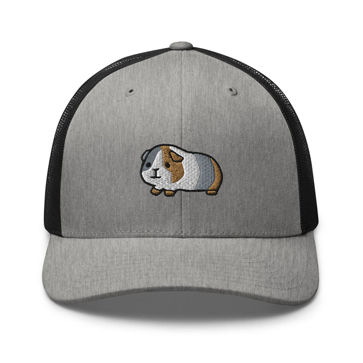 a gray and black cap with a brown and white dog on it