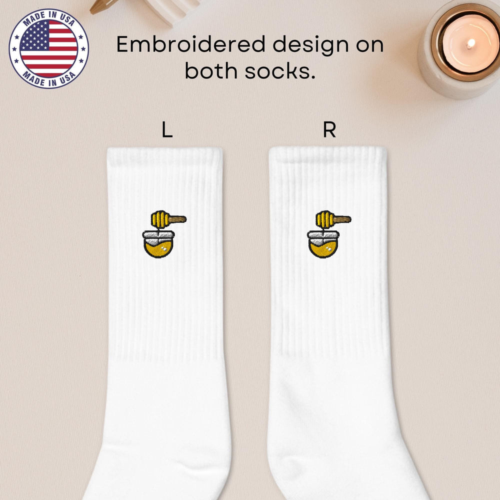 a pair of white socks with a cartoon character on them