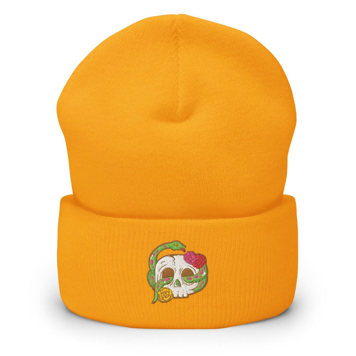 a yellow beanie with a skull on it
