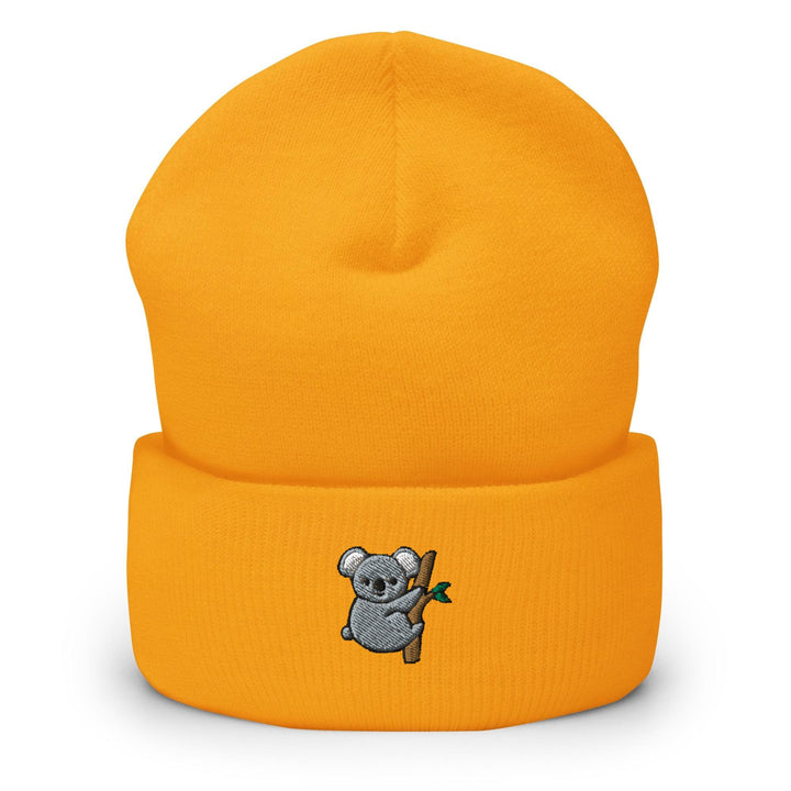 a yellow hat with a koala on it