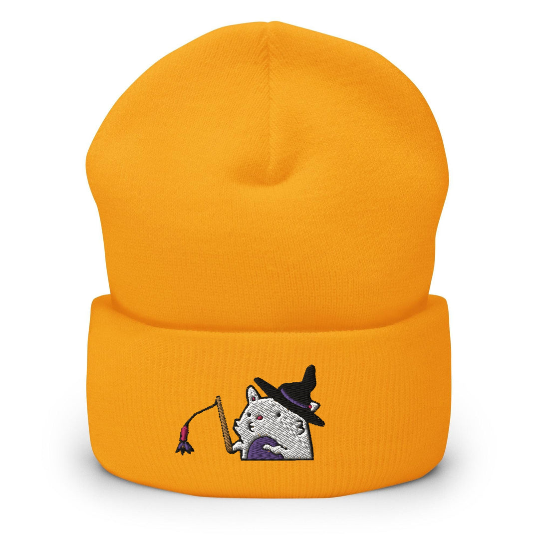 a yellow hat with a cat wearing a witches hat