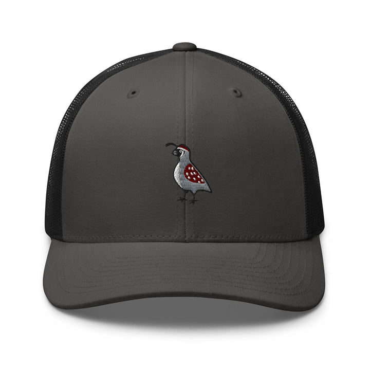 a gray and black trucker hat with a bird embroidered on the front