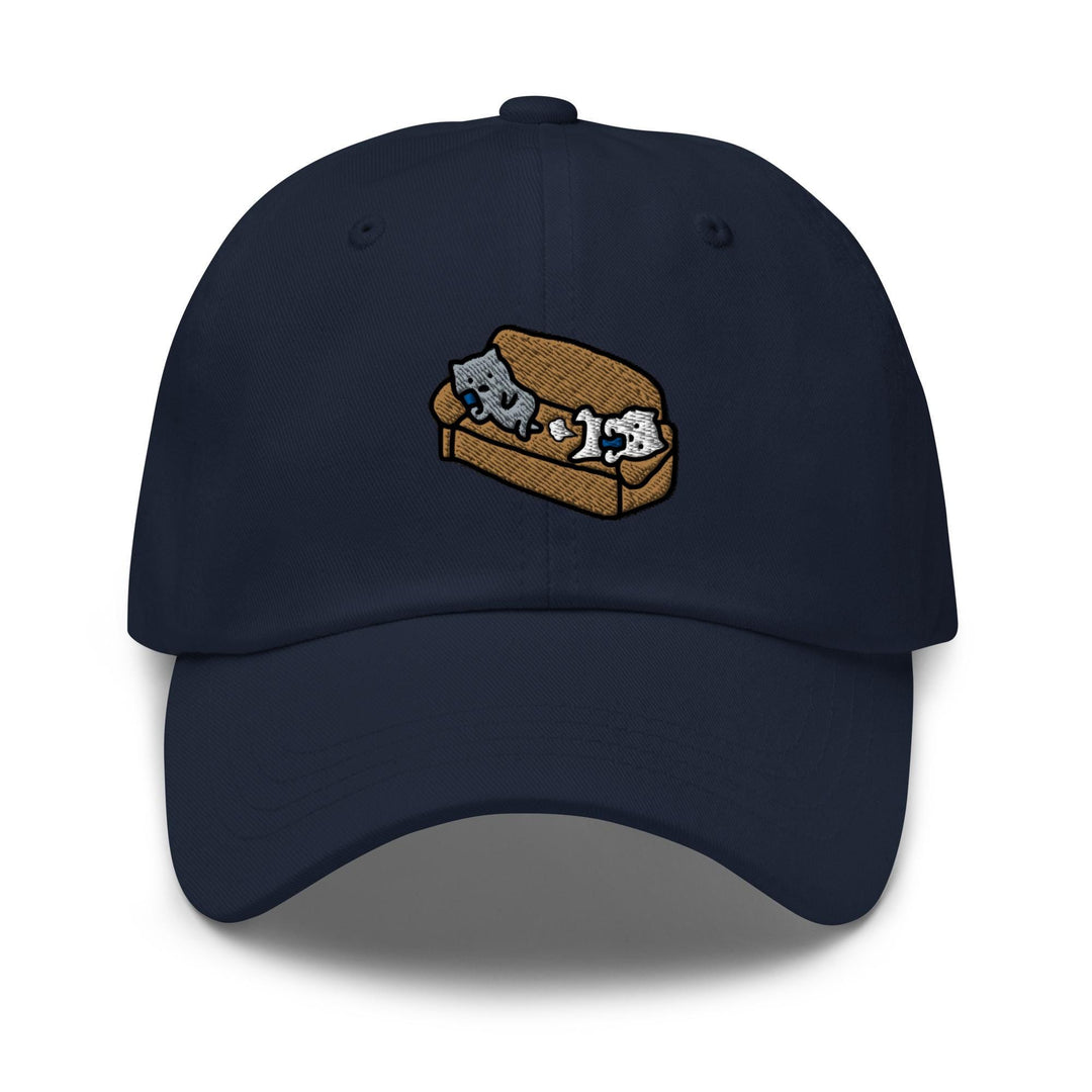 a blue hat with two cats on a piece of bread