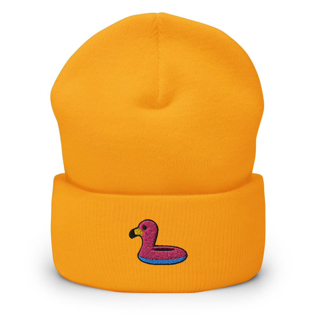 a yellow beanie with a pink ducky on it