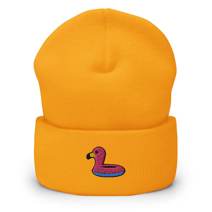a yellow beanie with a pink ducky on it
