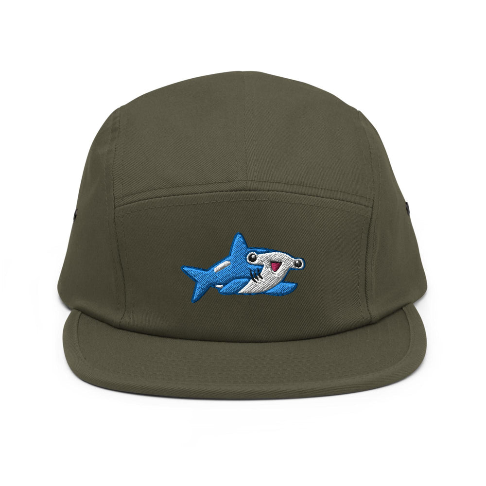 a green hat with a shark embroidered on it