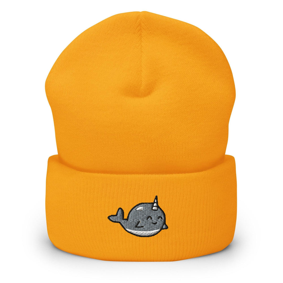 a yellow beanie with a whale embroidered on it