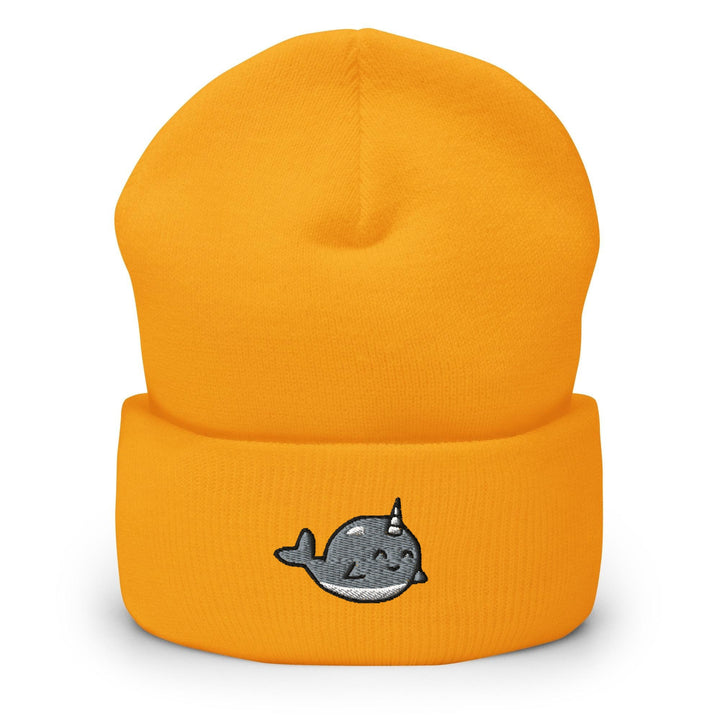 a yellow beanie with a whale embroidered on it