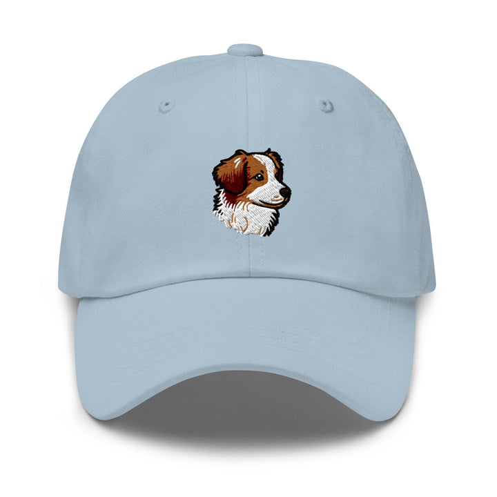a light blue hat with a picture of a dog on it