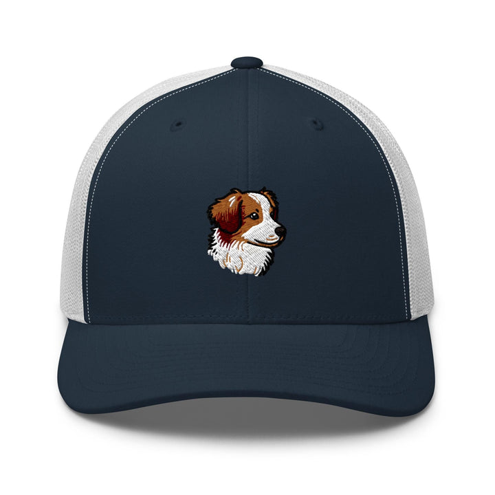 a blue and white trucker hat with a brown and white dog&#39;s face