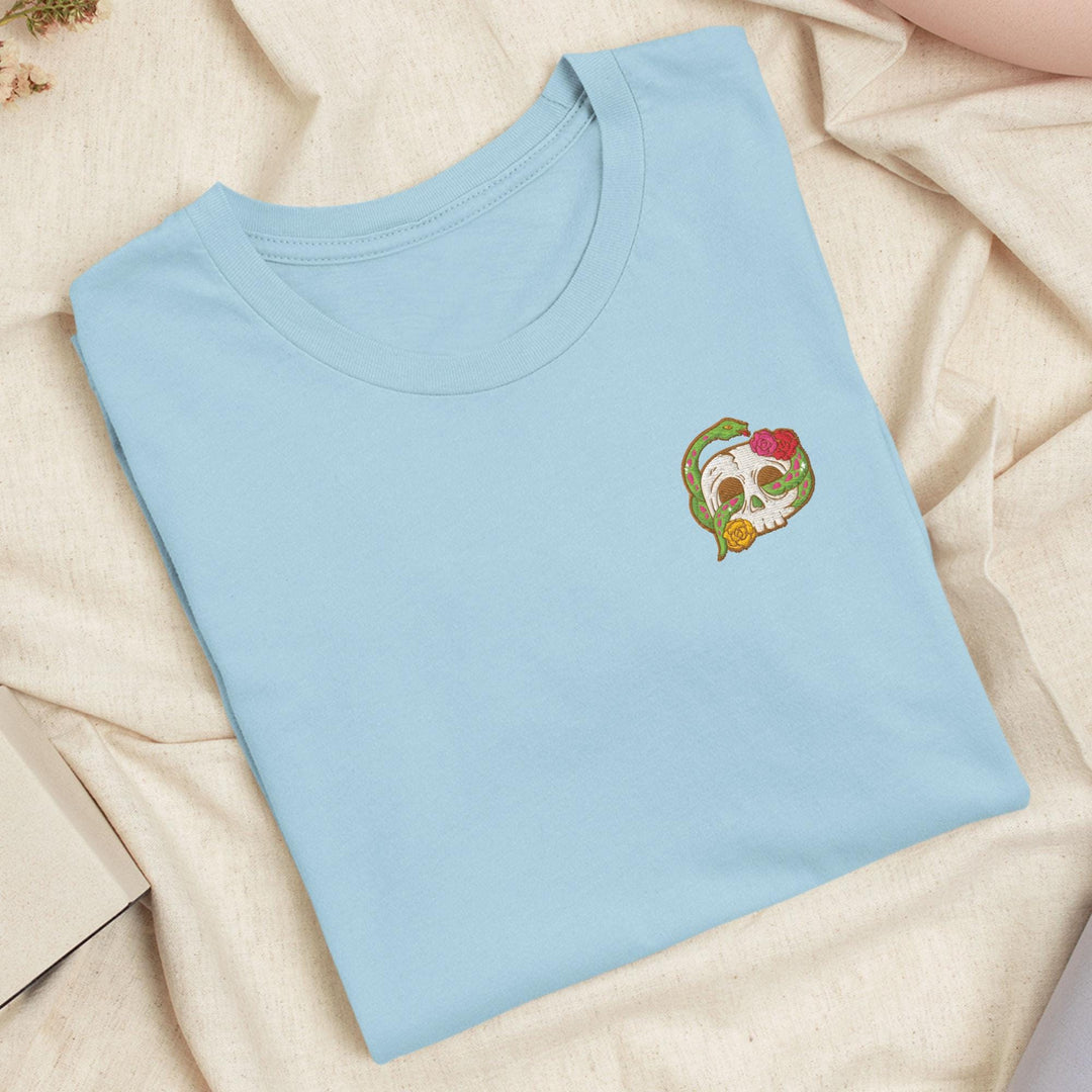 a blue t - shirt with a picture of a skull on it