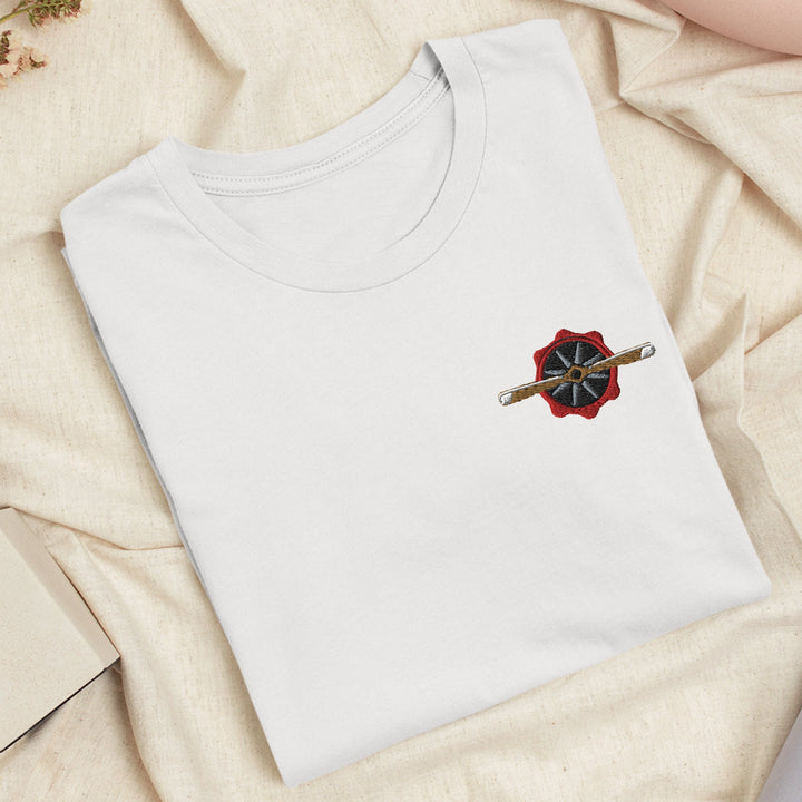 a white t - shirt with a red and black umbrella on it