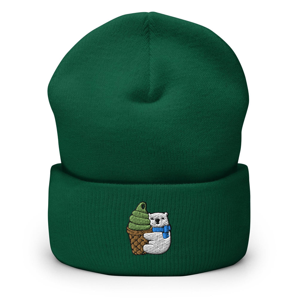 a green beanie with an image of a polar bear holding an ice cream cone