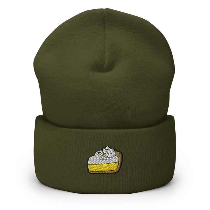 a green beanie with a piece of cake on it