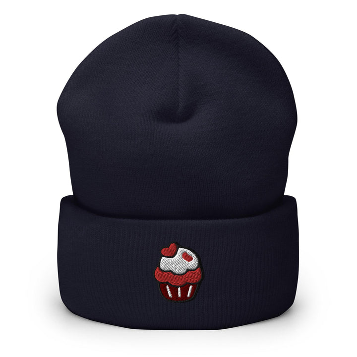 a beanie with a cupcake embroidered on it