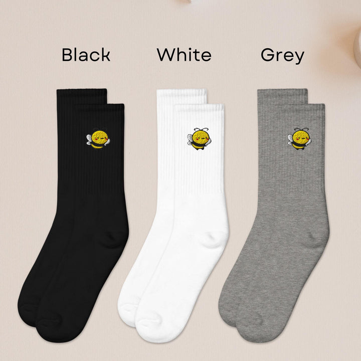 three pairs of black, white, and grey socks