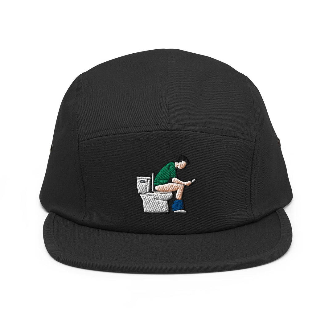 a black hat with a picture of a man sitting on a toilet