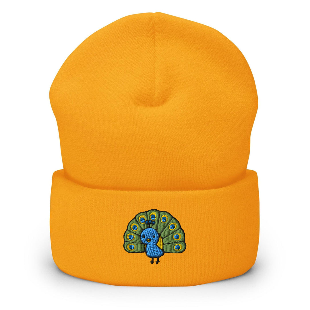 a yellow beanie with a blue peacock on it