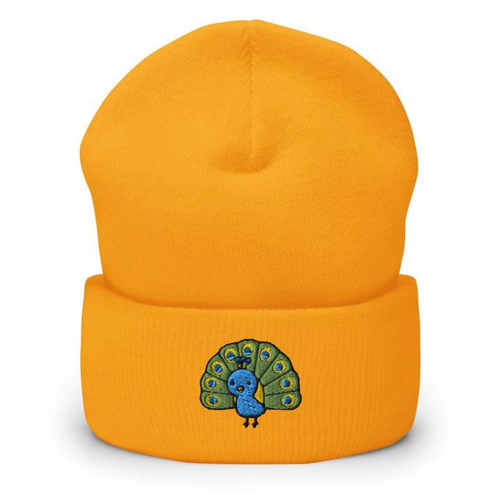 a yellow beanie with a blue peacock on it