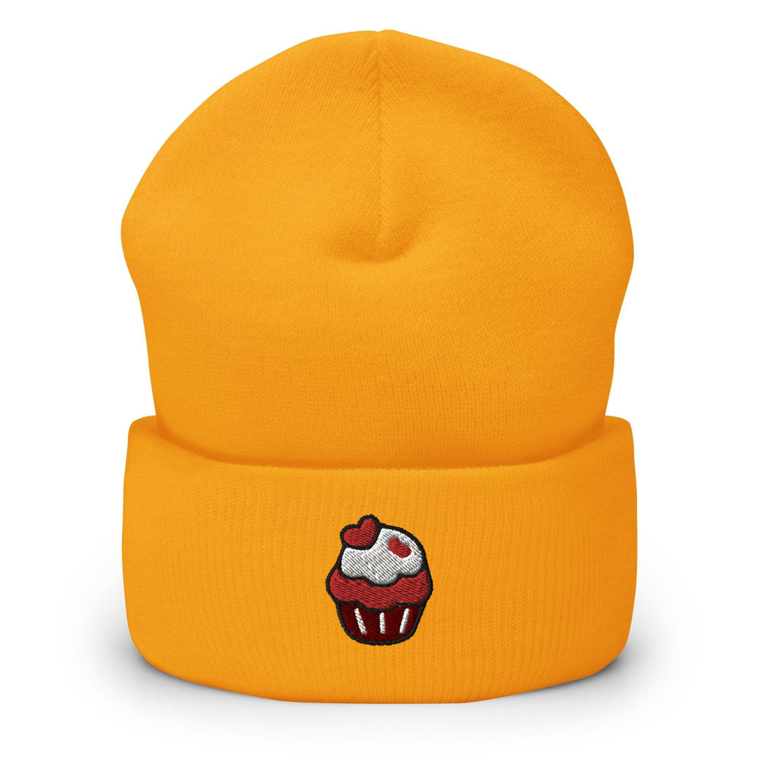a yellow hat with a cupcake embroidered on it