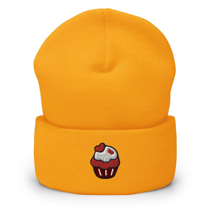 a yellow hat with a cupcake embroidered on it