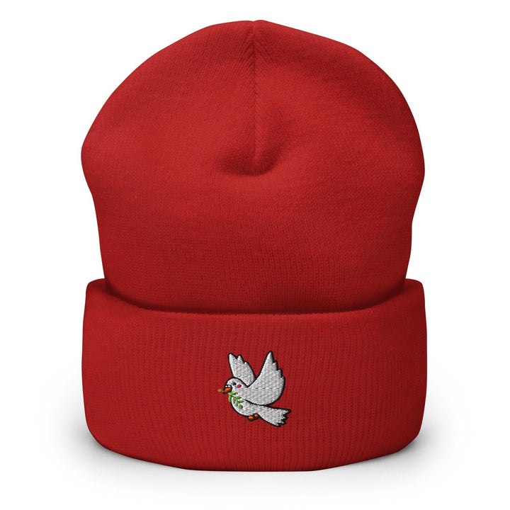 a red beanie with a white bird on it